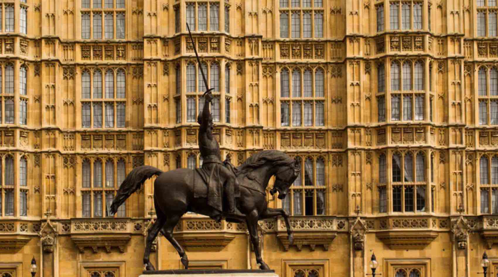 Statue of King Richard the Lionheart, the crusader king outside the Houses of Parliament, Westminster. Seated on his horse with his sword drawn.