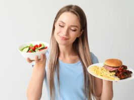 Eat this – Not that! Woman with healthy and unhealthy food.
